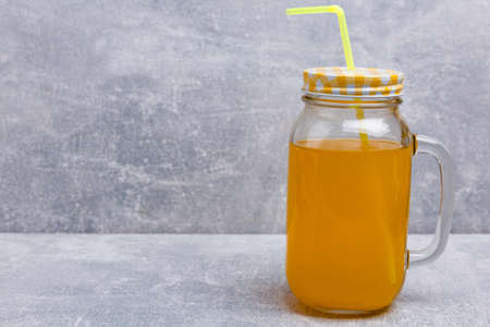 Lemonade in jar with a lid and straw.の写真素材