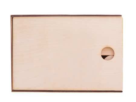 Wooden closed, square box, for children's geometric shapes, with a round hole, stands in a...