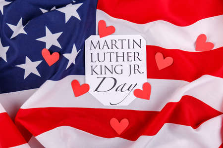 American flag close-up with an inscription and hearts cut outの写真素材