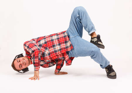 The guy makes an element from the bottom break on a gray backgroundの写真素材