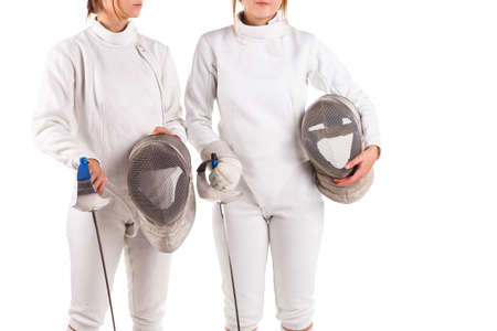 Two fencers, in a fencing uniform, hold a special fencing mask in their hands. Isolated on white...