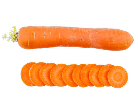 The whole carrot lies horizontally next to the sliced round carrot slices on a white isolated backgroundの写真素材