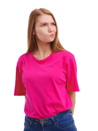 Emotional young girl hugging lips showing her negative interest. Expression of emotions. Isolated on white.の写真素材
