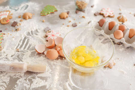 Products for baking cookies and cakes, preparation for baking. Flour with dough, eggs, eggshells,...