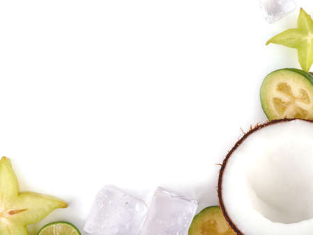Top view of a ripe and tropical slices of fruits with cubes of ice isolated on a white background.の写真素材