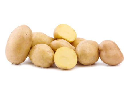 A pile organic, fresh and raw young potatoes, isolated on a white background. Human health staple food, potatoes. Healthful summer harvest.の写真素材