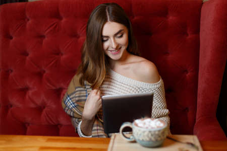 Pretty young lady resting in the cafe. Beauty concept.の写真素材
