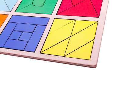 Educational colorful geometric figures. Ecological wooden toys for children concept isolated on a white background.の写真素材