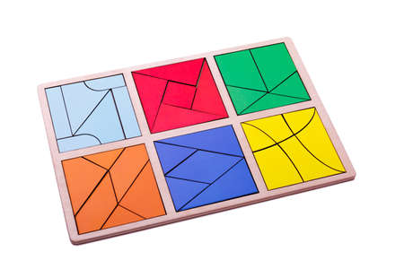Educational colorful geometric figures. Ecological wooden toys for children concept isolated on a white background.の写真素材