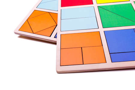 Educational colorful geometric figures. Ecological wooden toys for children concept isolated on a white background.の写真素材