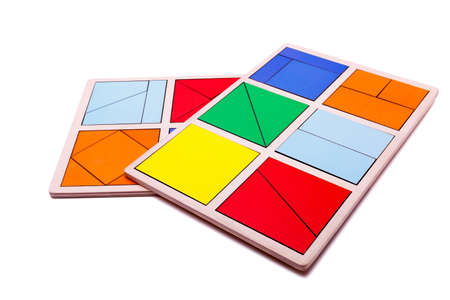 Educational colorful geometric figures. Ecological wooden toys for children concept isolated on a white background.の写真素材