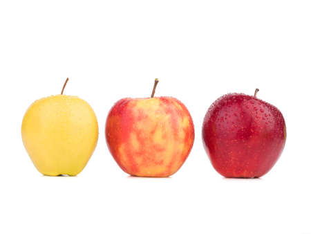 A heap of red, yellow and green apples isolated on a white background. Three fresh apples. Organic fruits.の写真素材