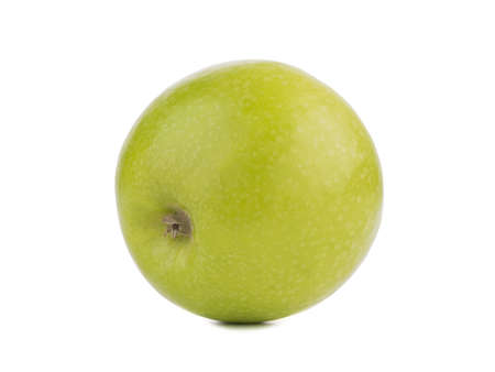 A whole bright green fresh apple isolated on a white background. Vitamins. The concept of healthy fruits.の写真素材