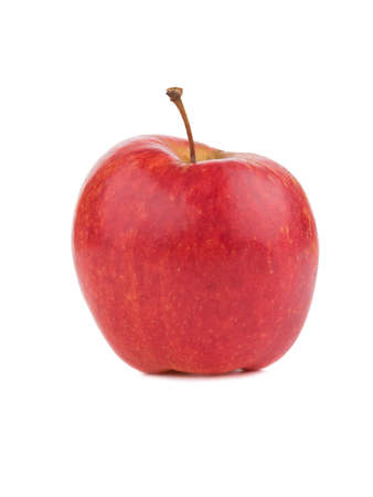 A whole bright red apple isolated on white background. Healthy and organic fruits full of vitamins. Fresh fruits conceptの写真素材