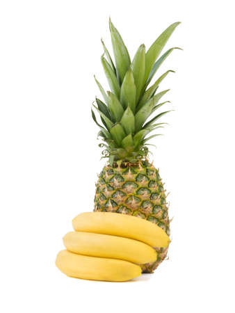 A bunch of yellow fresh bananas and a ripe pineapple isolated on a white background. Tropical fruits full of vitamins.の写真素材