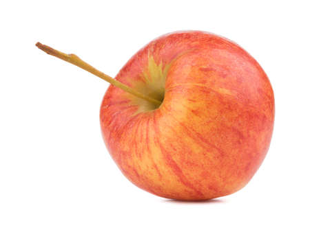 A whole bright red apple isolated on white background. Healthy and organic fruits full of vitamins. Fresh fruits conceptの写真素材