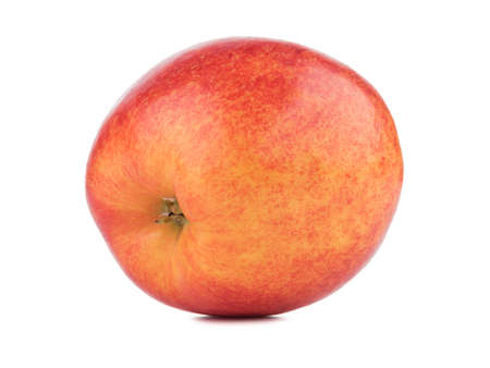 A whole bright red apple isolated on white background. Healthy and organic fruits full of vitamins. Fresh fruits conceptの写真素材
