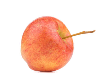 A whole bright red apple isolated on white background. Healthy and organic fruits full of vitamins. Fresh fruits conceptの写真素材