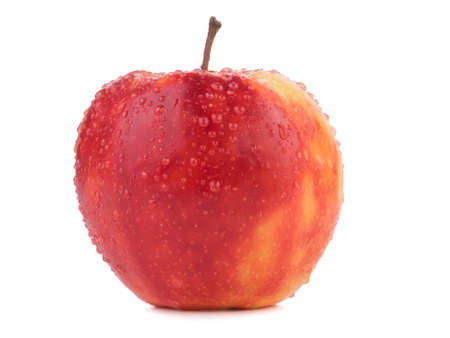 A whole bright red apple isolated on white background. Healthy and organic fruits full of vitamins. Fresh fruits conceptの写真素材