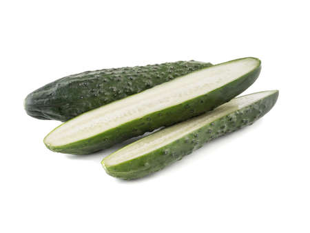A group of sliced cucumbers isolated on white background, close up. The concept of ripe and fresh vegetables.の写真素材