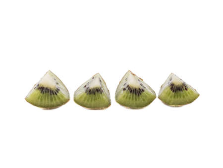 Sliced ripe kiwi with seeds isolated on a white background. A concept of exotic fruits full of vitaminsの写真素材