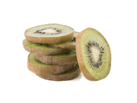 Sliced ripe kiwi with hairy brown skins isolated on a white background. A concept of exotic fruits full of vitaminsの写真素材