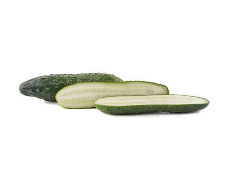 A group of sliced cucumbers isolated on white background, close up. The concept of ripe and fresh vegetables.の写真素材