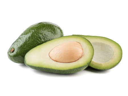 Whole and sliced avocado with stone isolated on white background, close-up. The concept of healthy foodの写真素材