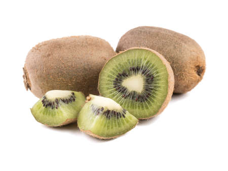 Sliced on halves and whole ripe kiwis isolated on a white background. Hairy brown kiwi with seeds. A concept of exotic fruits full of vitaminsの写真素材