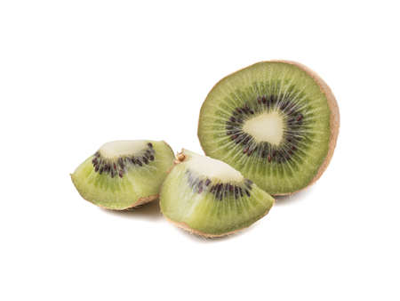 Sliced on halves and whole ripe kiwis isolated on a white background. Hairy brown kiwi with seeds. A concept of exotic fruits full of vitaminsの写真素材