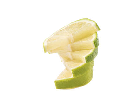 Green slices of ripe and fresh lime isolated on white background. A concept of citrus fruits full of vitaminsの写真素材