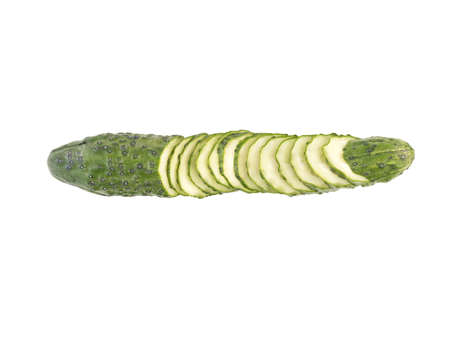 Chopped cucumber isolated on white background, close-up. The concept of ripe and fresh vegetables.の写真素材