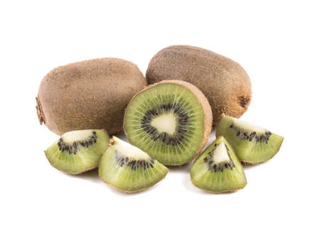 Sliced on halves and whole ripe kiwis isolated on a white background. Hairy brown kiwi with seeds. A concept of exotic fruits full of vitaminsの写真素材