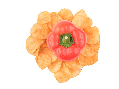 Top view of crispy potato chips with spices from red pepper isolated on a white background. Junk food concept. Close-up of a fast snack.の写真素材