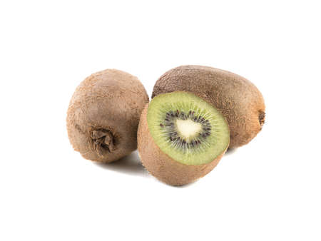 Sliced on halves and whole ripe kiwis isolated on a white background. Hairy brown kiwi with seeds. A concept of exotic fruits full of vitaminsの写真素材