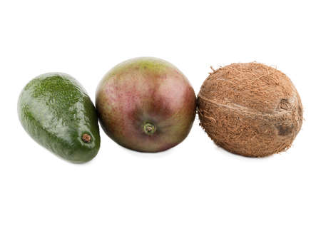 Fresh and whole coconut, mango and avocado isolated on a white background. A concept of exotic...