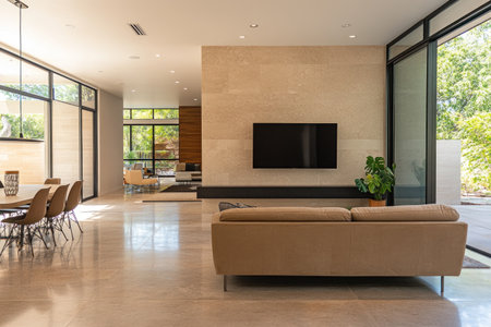 Modern living room with light beige marble wall, TV and sofa in the background, dining table on the left side of the frame, concrete floor, minimalist interior design, natural lighting from large windows, neutral color palette. --ar 3:2 --v 6.1 Job ID: cff0c91a-b5ff-4335-b9b7-f016e1cb4c49の素材