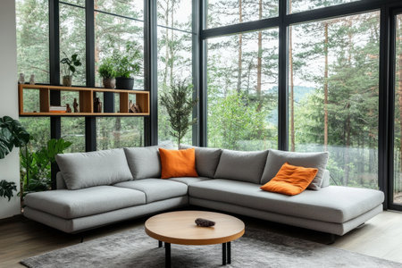 A modern living room with large windows, featuring an L-shaped gray sofa and a coffee table in front of it. The space is filled with natural light from the expansive glass walls, creating a bright atmosphere. A wooden shelf holding plants adds warmth to the decor. In one corner, an orange pillow sits on top of the couch for extra comfort. This setting creates a contemporary yet inviting ambiance, perfect for relaxation or social gatherings. --ar 3:2 --v 6.1 Job ID: 8089f31f-0391-4a06-b263-f4d632cf9410の素材