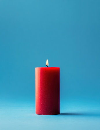 A red candle on a blue background, minimalist high-resolution photography. --ar 23:30 --v 6.1 Job ID: 0f9ee75e-869b-4d33-ad54-5dca4ac081baの素材