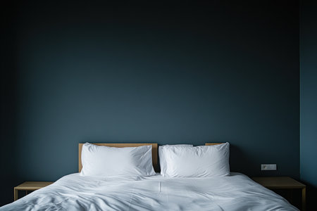 Photo of a minimalist hotel room with sleek, modern furniture and a simple white bed set against grey walls. The focus is on the headboard that has two small square wooden panels. There's also an end table beside it, adding to its clean aesthetic. --ar 3:2 --v 6.1 Job ID: 287730a0-3e44-4f69-be96-b39a60b36293の素材