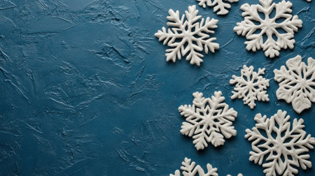 Blue background with snowflakes at the top and bottom, creating an atmosphere of cold weather. The design is simple yet elegant, perfect for conveying winter vibes or festive themes. It features white snowflake patterns on a blue textured paper, adding depth to the composition. This banner-style image has a high resolution and detailed texture that captures the beauty of snowy landscapes. Snowy theme, winter mood, snow pattern, snowflake decoration, blue color tone, snow sparkles. --chaos 30 --ar 16:9 --v 6.1 Job ID: 11116b1b-5251-415d-999d-90b98caa26b3の素材