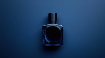 Black perfume bottle on a dark blue background with copy space, close-up view. Modern luxury men's or women's perfume mock-up. Top-down view. High-resolution photography, insanely detailed, fine details, stock photo, professional color grading, hyper-realistic. --ar 128:71 --v 6.1 Job ID: 23ccdd2a-7df3-4b69-aea7-8adb8b200956の素材