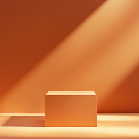 A minimalistic orange background with an empty cube for product display, bathed in warm sunlight that creates soft shadows and highlights the orange color of the wall. The composition is simple yet elegant, providing space to add text or branding elements as needed. This scene presents a clean and professional presentation design. --v 6.1 Job ID: 6a671991-aa06-4f4e-9a2b-1ca04f55fe48の素材