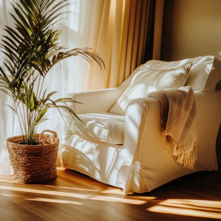 Photo of a cozy armchair in front of a large window with sunlight streaming through, creating soft shadows on the wall and floor. The chair is adorned with white cushions and sits next to an indoor plant basket, adding life to your home decor. 16:9 --chaos 30 --v 6.1 Job ID: 88c9395a-72e2-4216-914a-c3cd67ad29eeの素材