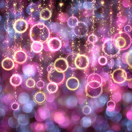 Soft focus abstract of glowing rings and orbs with a pink, purple, and gold paletteの素材