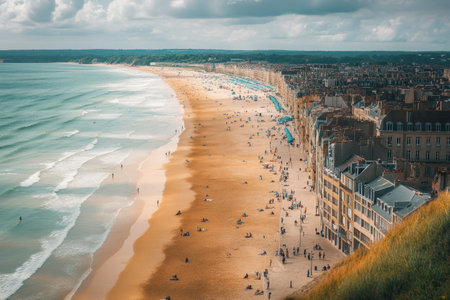 View of Normandy's beaches from the top, a wide shot of the sandy beach with buildings and people on it, in France. Photorealistic, in the style of Canon EOS R5. --ar 3:2 --v 6.1 Job ID: 78047540-dada-462d-a1f1-c7ecc1517937の素材