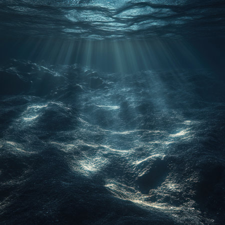 Underwater view of the ocean floor, with sunlight filtering through the water and creating ripples on its surface. The background is a dark blue, creating an atmosphere reminiscent of deep-sea exploration. There is no visible marine life in sight. --v 6.1 Job ID: cf397141-73ea-4414-82e4-7db1e46c6ef8の素材