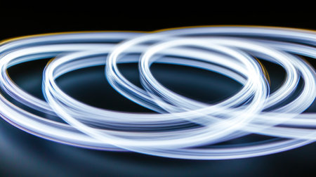 Close-up of an abstract light painting, with glowing white and yellow lines swirling around the frame, creating an ethereal atmosphere against a neutral background. The focus is on the delicate interplay between these lights, capturing their dynamic movement in soft backlighting. --chaos 30 --ar 16:9 --v 6.1 Job ID: 5cfe5ded-46f0-4c95-a2a2-1a865a78950dの素材