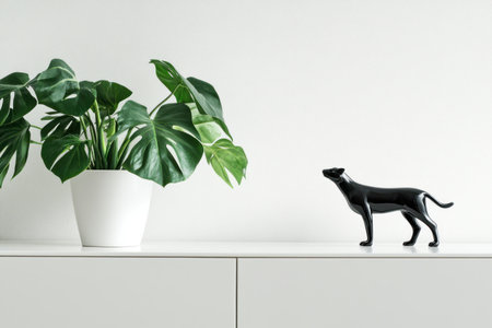 Minimalist white sideboard with a monstera plant and animal figurine, white background, close-up shot, simple composition, high-resolution photography, natural lighting, high-key lighting, sharp focus, detailed, clean, modern interior design style. --ar 3:2 --v 6.1 Job ID: cc620d7b-a560-4ab9-8c31-2dce5f89ab45の素材