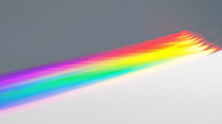 A single, narrow rainbow arches across the sky against a grey background. The light from behind shines through, creating an iridescent effect on the white surface below. It's a simple yet beautiful scene that captures the natural beauty of sunlight. --chaos 30 --ar 16:9 --v 6.1 Job ID: 84a2122e-57ca-48ad-adba-e77453572902の素材